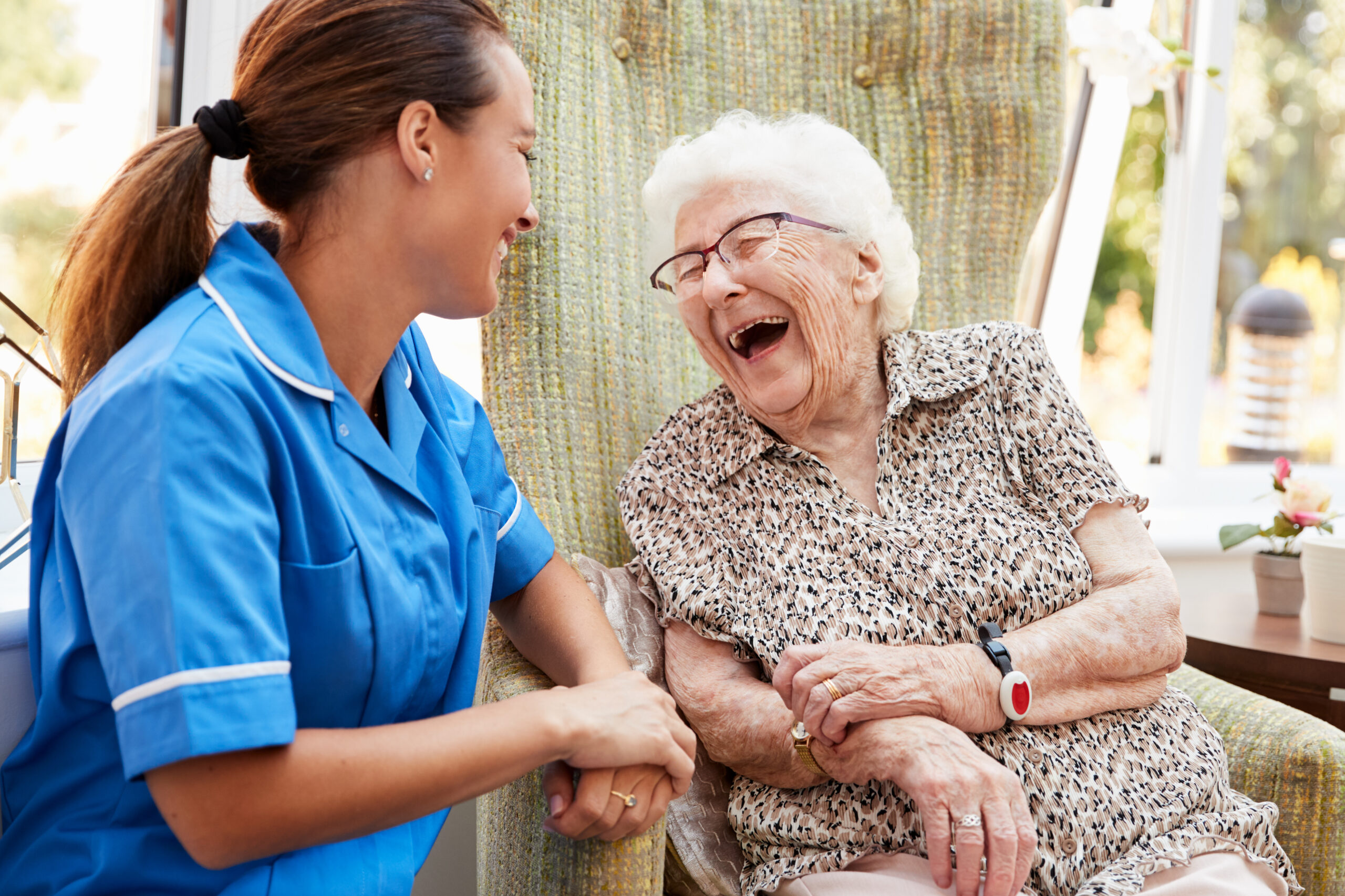 Resident laughing with Nurse